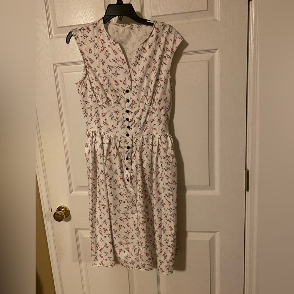 Fit and flair dress midi length. Button front sleeveless